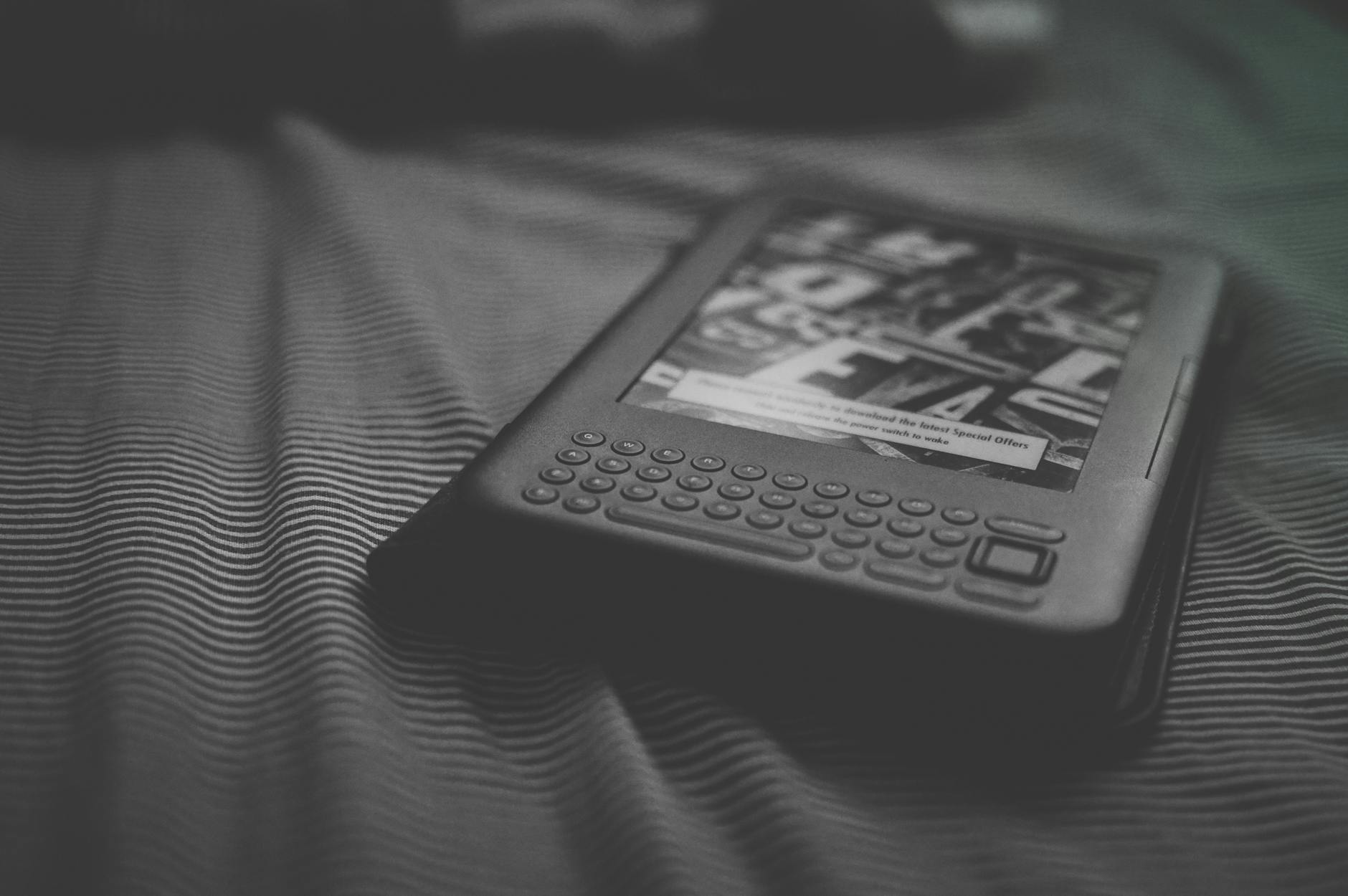 grayscale photo of e reader